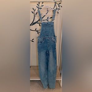 Gently worn H&M overalls with distressed bottoms.